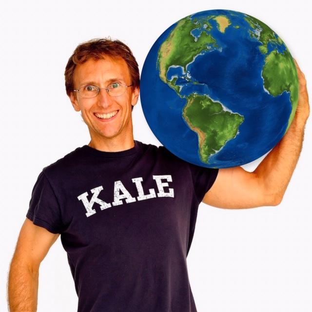 LWH co-founder, JP, facing front; wearing a black t-shirt that reads KALE and cradling the earth on his left shoulder